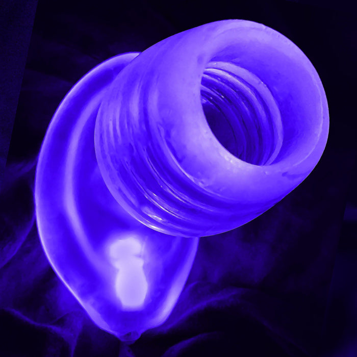 plug anal con hueco para abrir el ano de color transparente alumbrado por la led de color morado